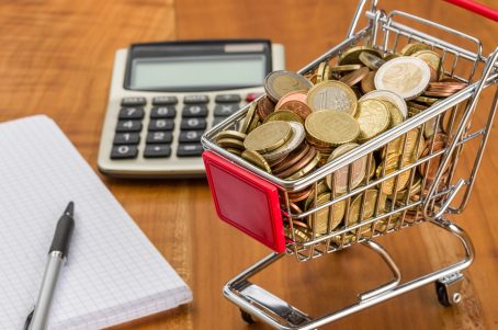 Shopping cart full of coins