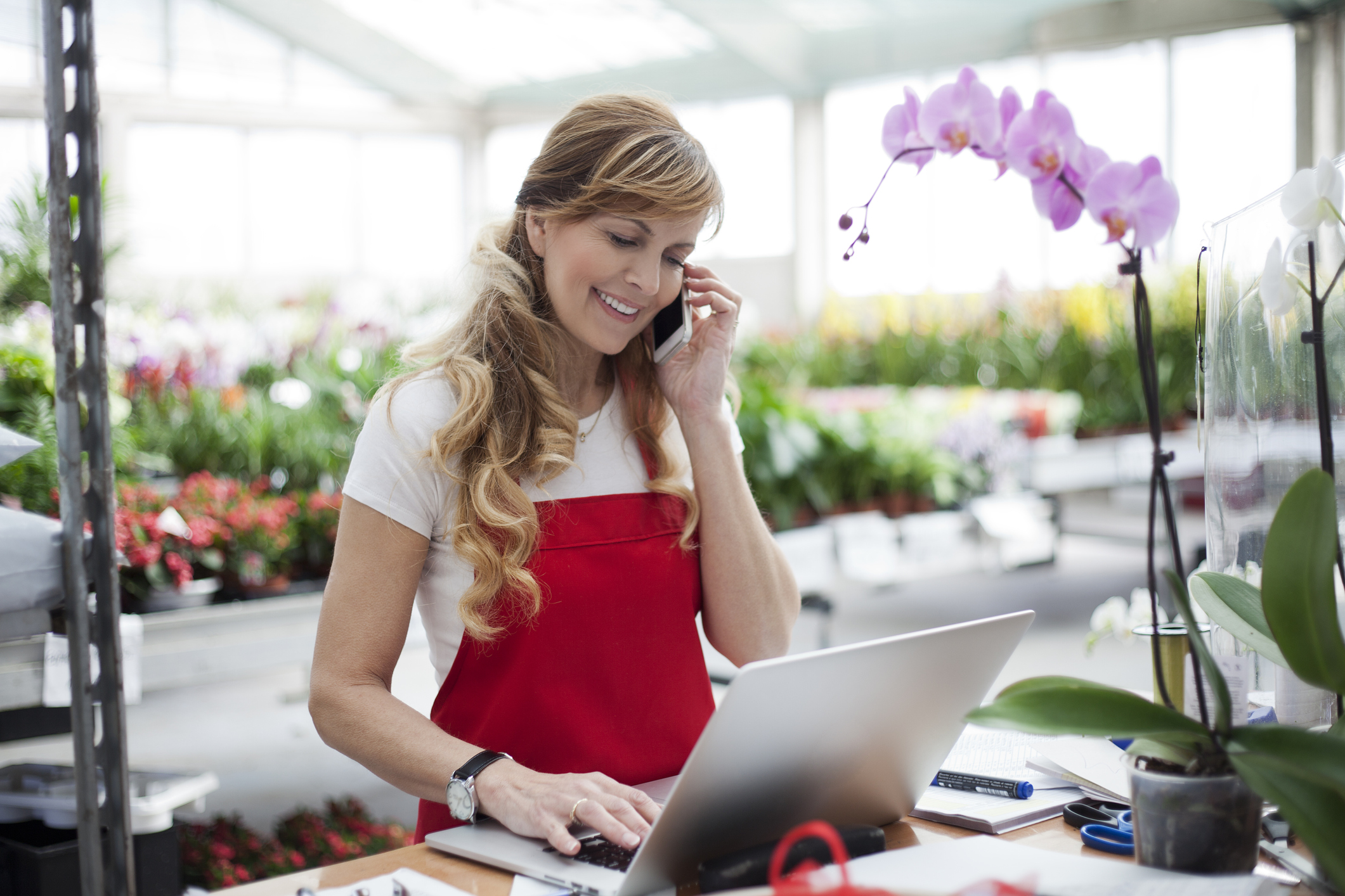 smiling clerk at garden retail store