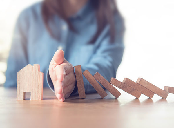 Woman stopping domino effect