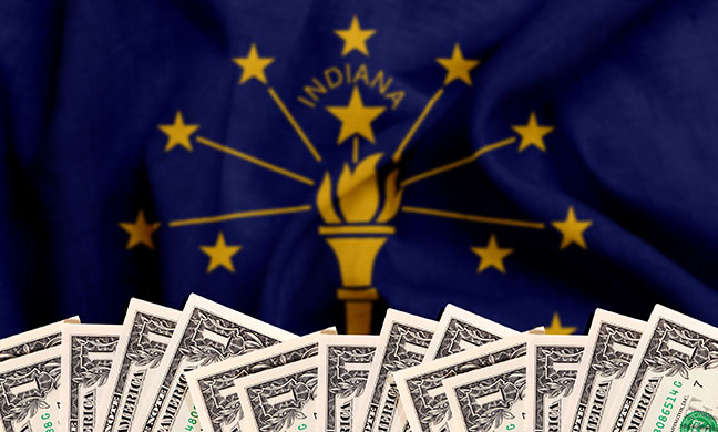 Row of dollar bills in front of Indiana state flag