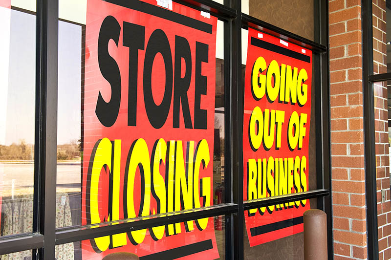 Going out of business sign on store window