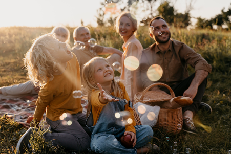 Happy family spending time outdoors after relieving debt